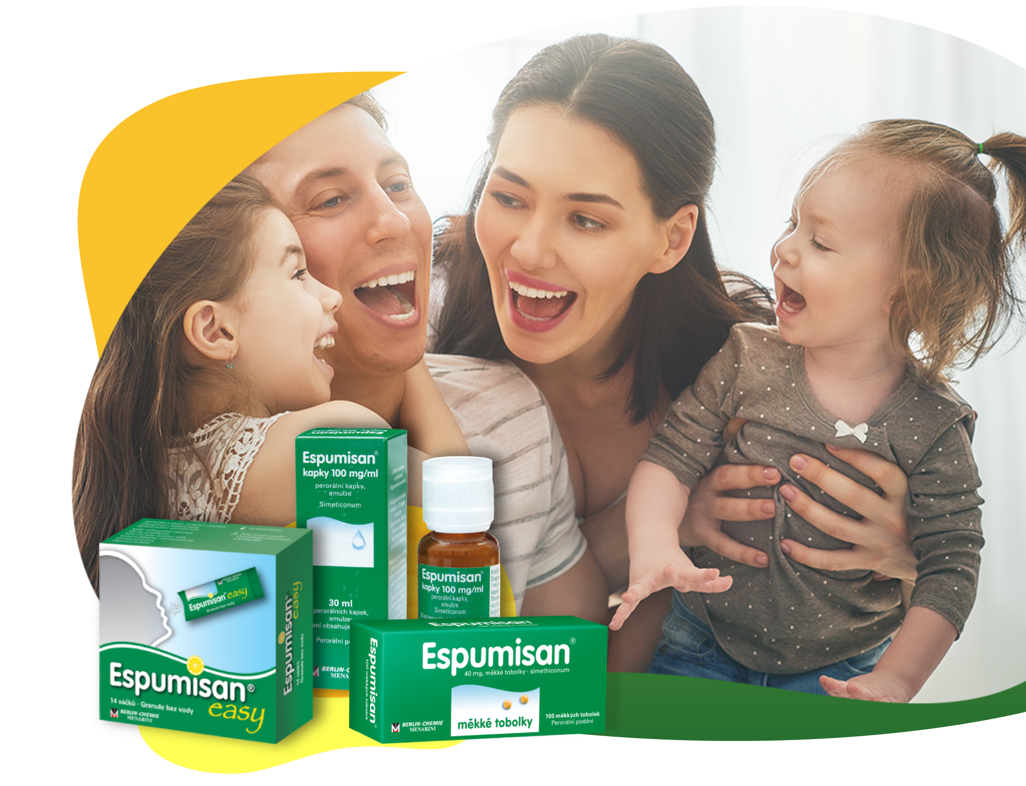 Mladá rodina v dobré náladě, která se bezstarostně směje po užití Espumisanu: Každý z rodičů drží jedno dítě, v popředí jsou balení Espumisanu v různých lékových formách pro různé potřeby.